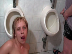 Blonde used as a urinal in public toilet