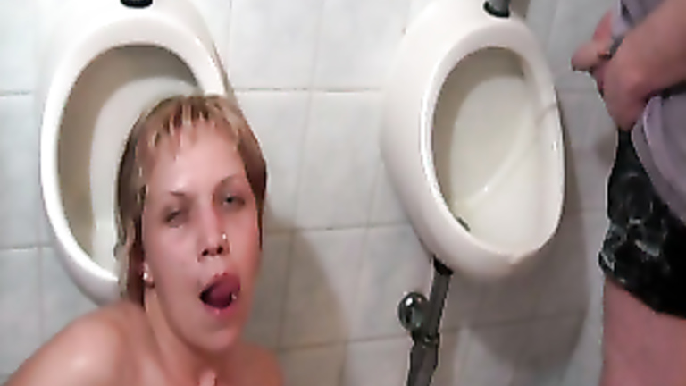 Blonde used as a urinal in public toilet voyeurstyle