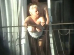 Man tries to seduce curvy mommy on a hotel balcony