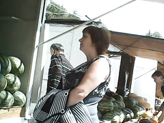 Ukrainian mature brunette at the vegetable market