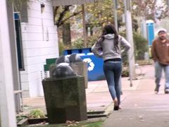Desperate chick wetting her jeans on the street