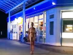 Naked slave in a collar shops at a convenience store