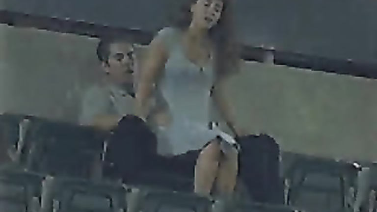 Horny friends make love in the high seats of the stadium