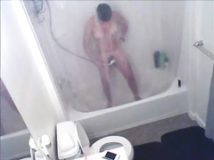 Short-haired babe is recorded while showering