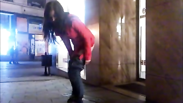 Drunken cutie pissing on a public sidewalk