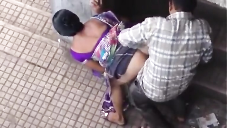 Public doggystyle quickie with an Indian girl voyeurstyle picture