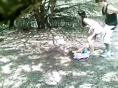Doggystyle quickie under the shade of a tree