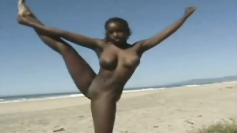 Naked black chick at the beach