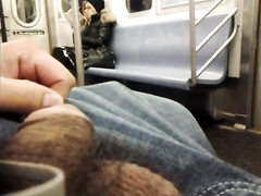 Stroking cock to the hot blonde on the subway