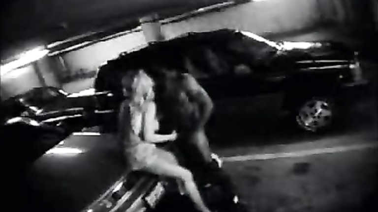 Parking garage sex on security camera with a charming blonde