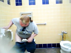 Chubby blonde uses the public toilet