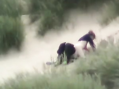 Voyeur sex in the dunes on a breezy day