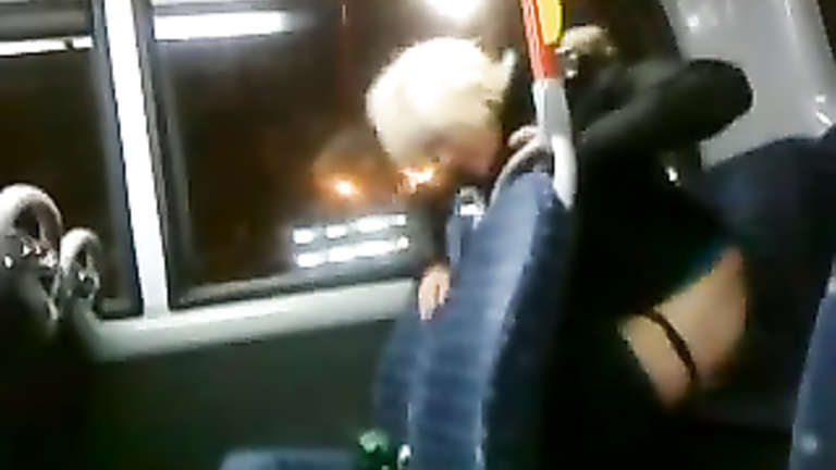 Drunk blonde madam pissing in the back of the bus