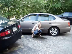 Laughing chick relieves herself in a parking lot