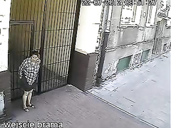 Elder lady taking a leak on the street