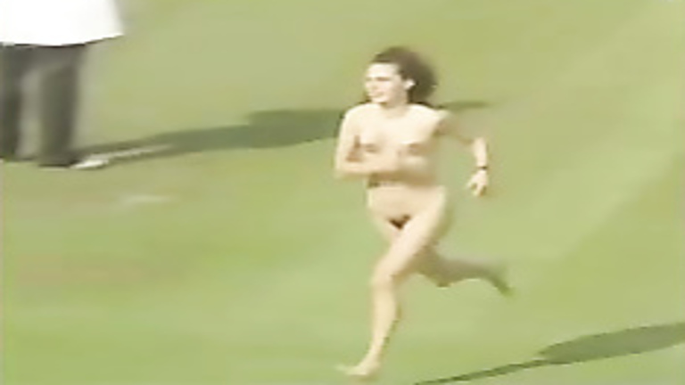 Female streaker runs across the stadium