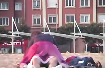 Rubbing the pussy on boyfriend's cock on the public beach