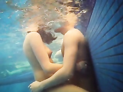 Sexually excited tourists having the underwater sex