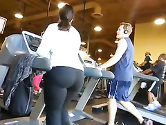 Fat ass woman walks on the treadmill