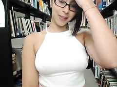 Voluptuous cam girl toys her ass in the library