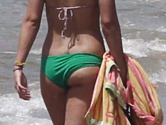 Tanned woman with a nice butt at the beach