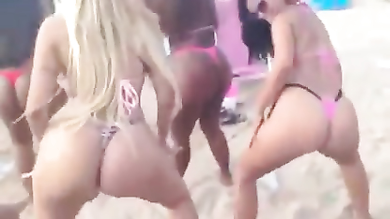 Big Brazilian butts in thongs dancing at the beach