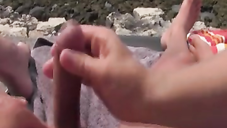 Wife treats me to a handjob at the beach