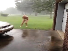 Naked girlfriend runs outdoors in a hurricane