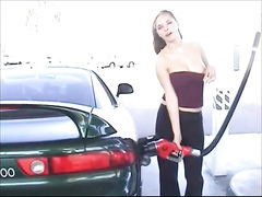 Pretty lady exposes her boobies at the gas station