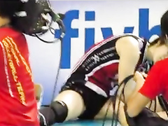 Asian volleyball girls stretch before a match