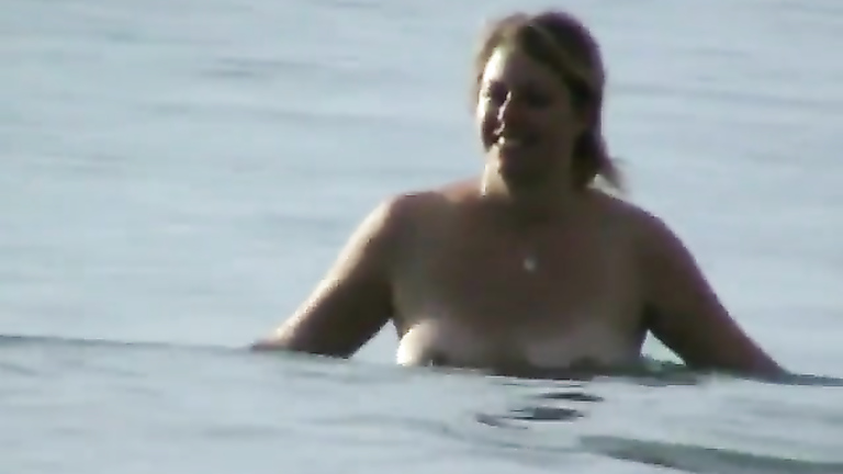 Milf with saggy tits goes skinny dipping in the ocean voyeurstyle picture