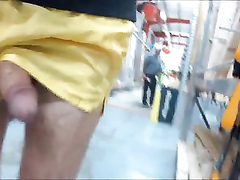 Flashing cock in nylon shorts at the hardware store