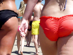 Big female booty in an orange bikini is breathtaking
