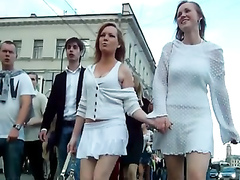 Short white skirts on beauties walking the city