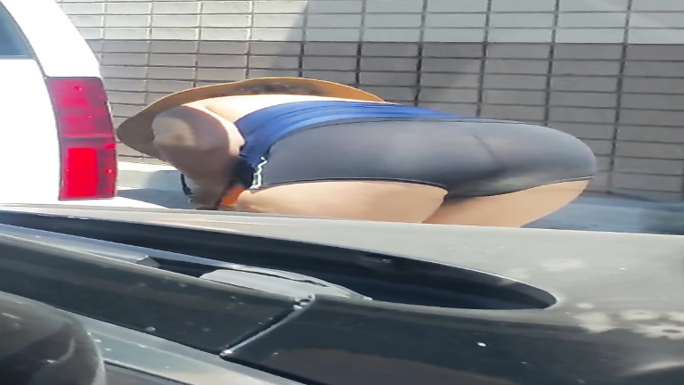 Awesome bubble booty on a chubby woman in spandex shorts