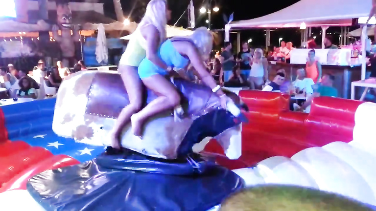 Bimbos in panties ride the mechanical bull together