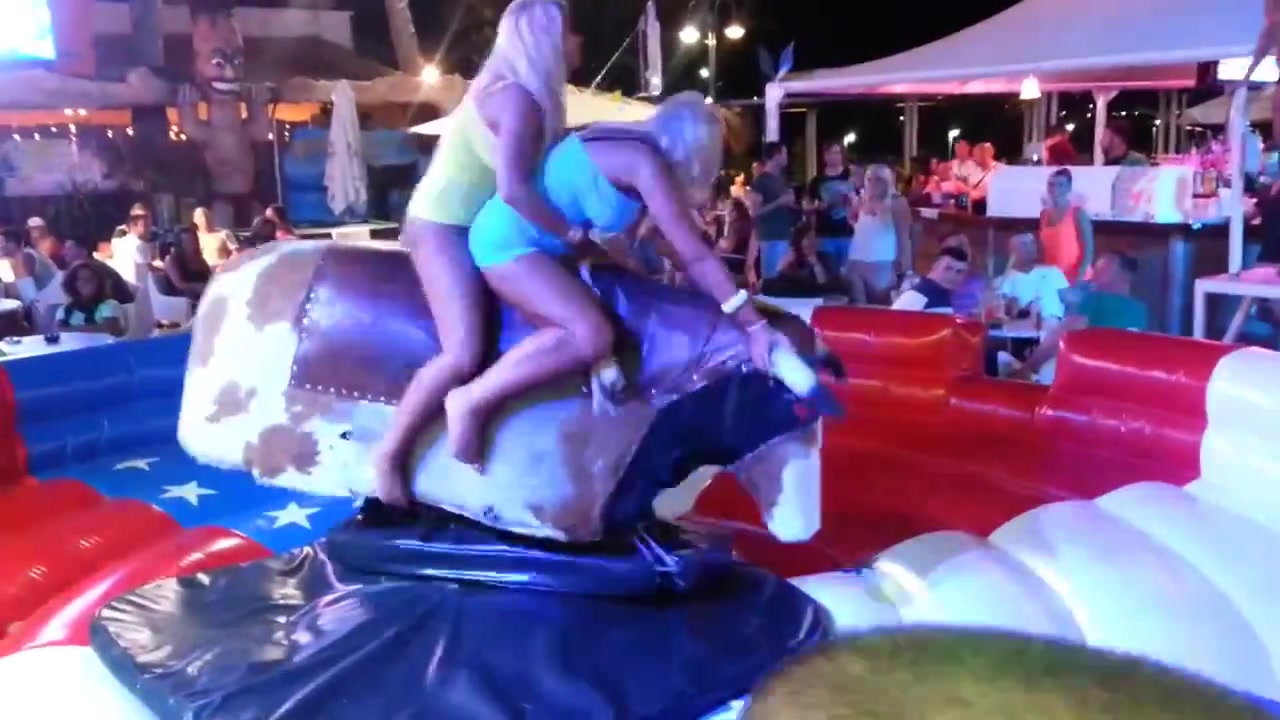 Bimbos in panties ride the mechanical bull together voyeurstyle