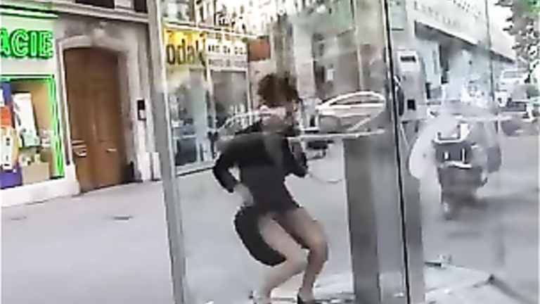 Sexy lady flashes her pussy in a phone booth