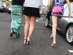 Slow motion walk with beauties in short skirts