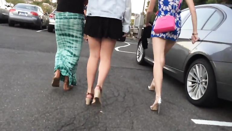 Slow motion walk with beauties in short skirts