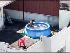 Doggystyle screwing outdoors in the pool