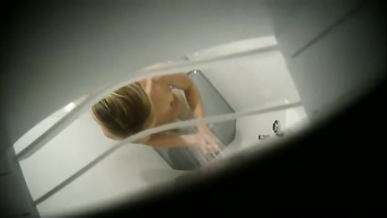 Skinny showering blonde spied on from the fan above
