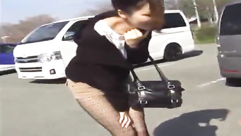 Fashionable Japanese doll pees her shorts outdoors