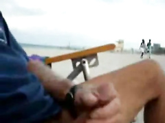 Stroking my dick on the public beach