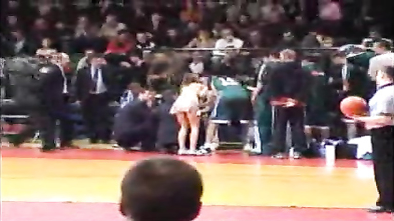 Topless girl streaks at a basketball game