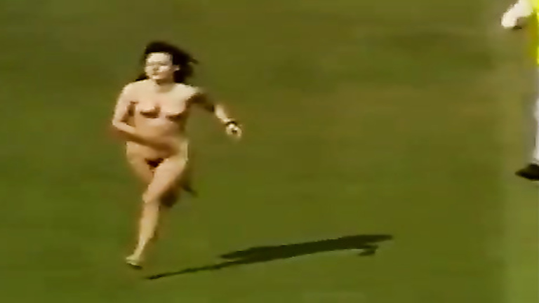 Naked woman streaks across the pitch