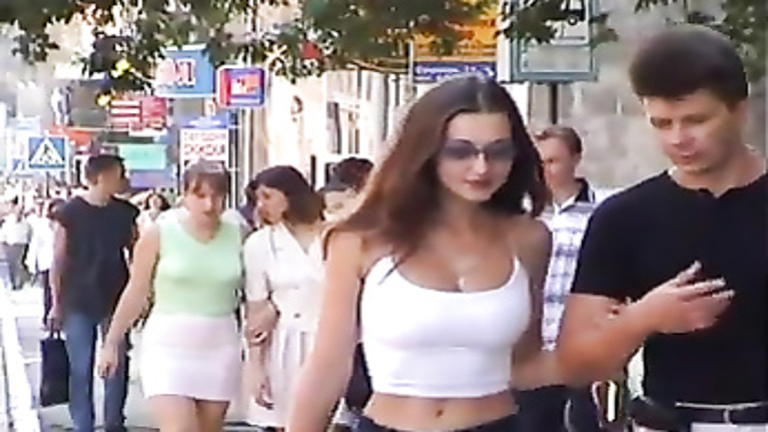 Scantily clad women in the city on a spring day