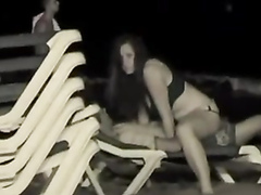 Night sex on a public beach with the girl on top