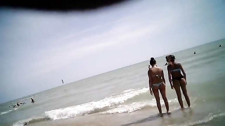 Capturing a quick shot of bikini girls in the water