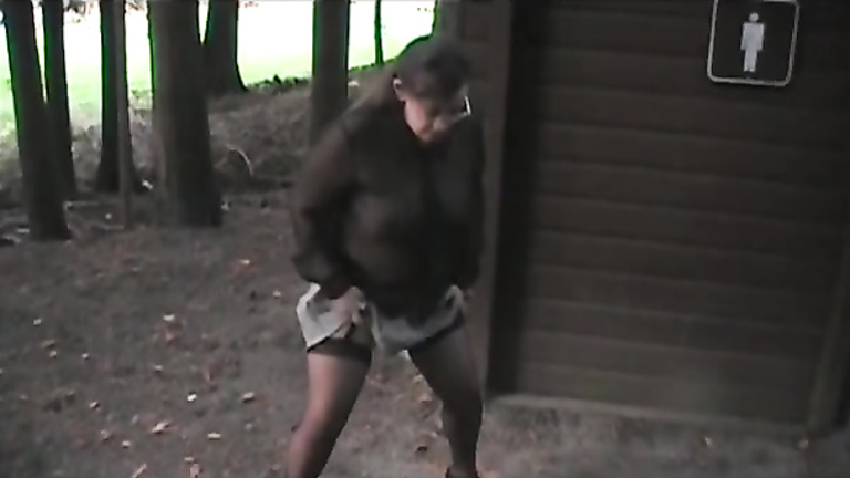 Slutty outfit on a wife urinating in the woods